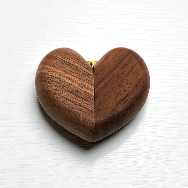 Wooden heart-shaped box on a white background