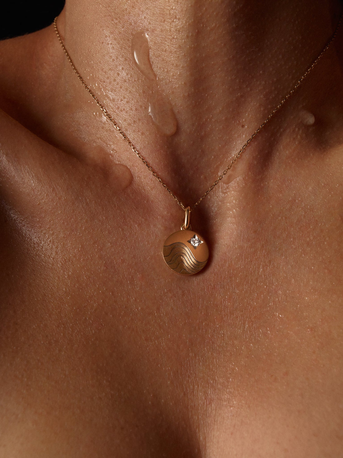 Model wearing Water Pendant Necklace in Yellow Gold