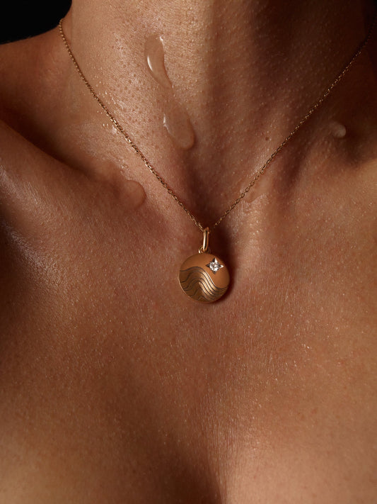 Model wearing Water Pendant Necklace in Yellow Gold