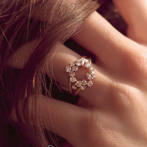 Crescent-shaped man-made diamonds set in yellow gold jewellery, featuring rings and earrings